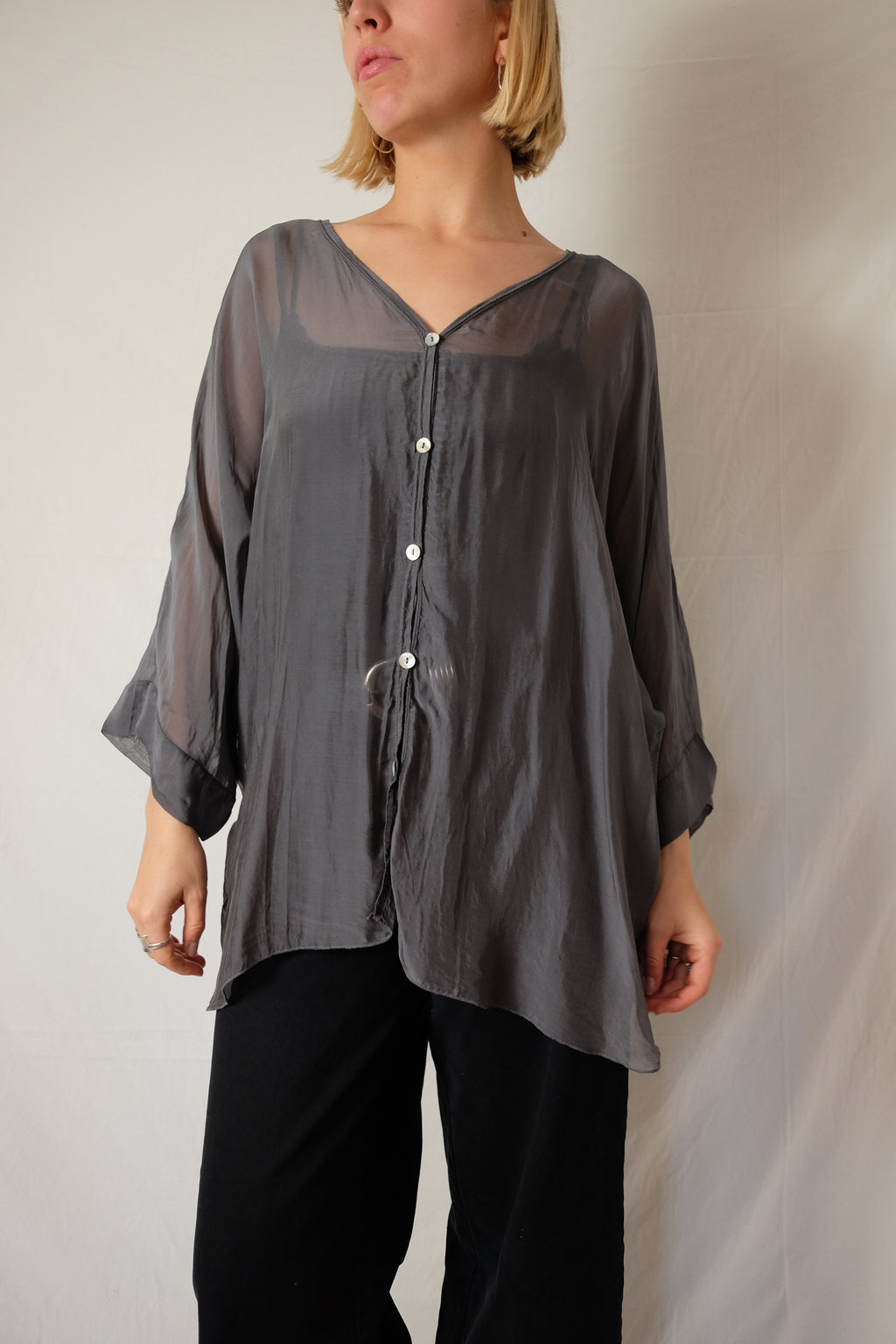 see-through flowy blouse