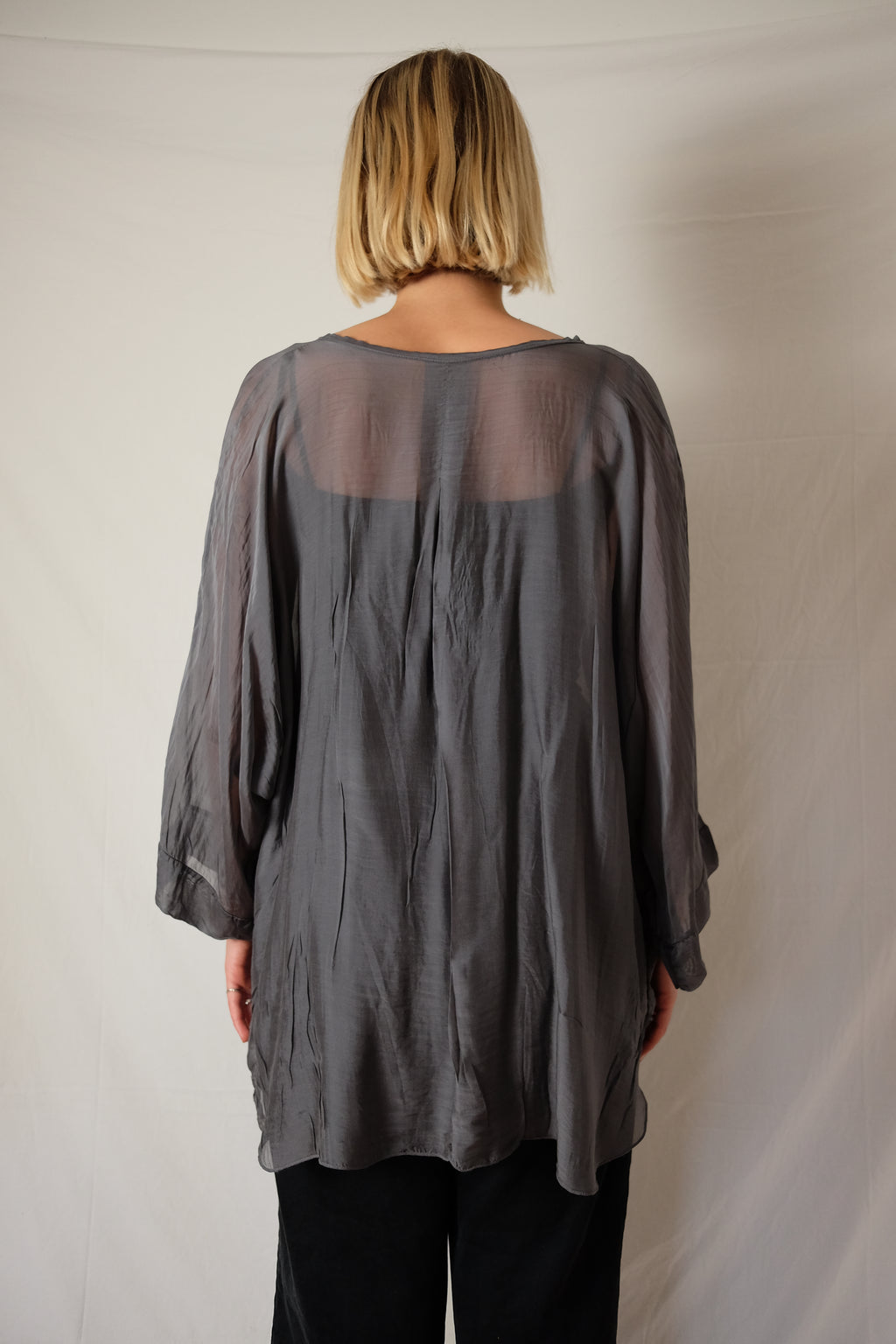 see-through flowy blouse